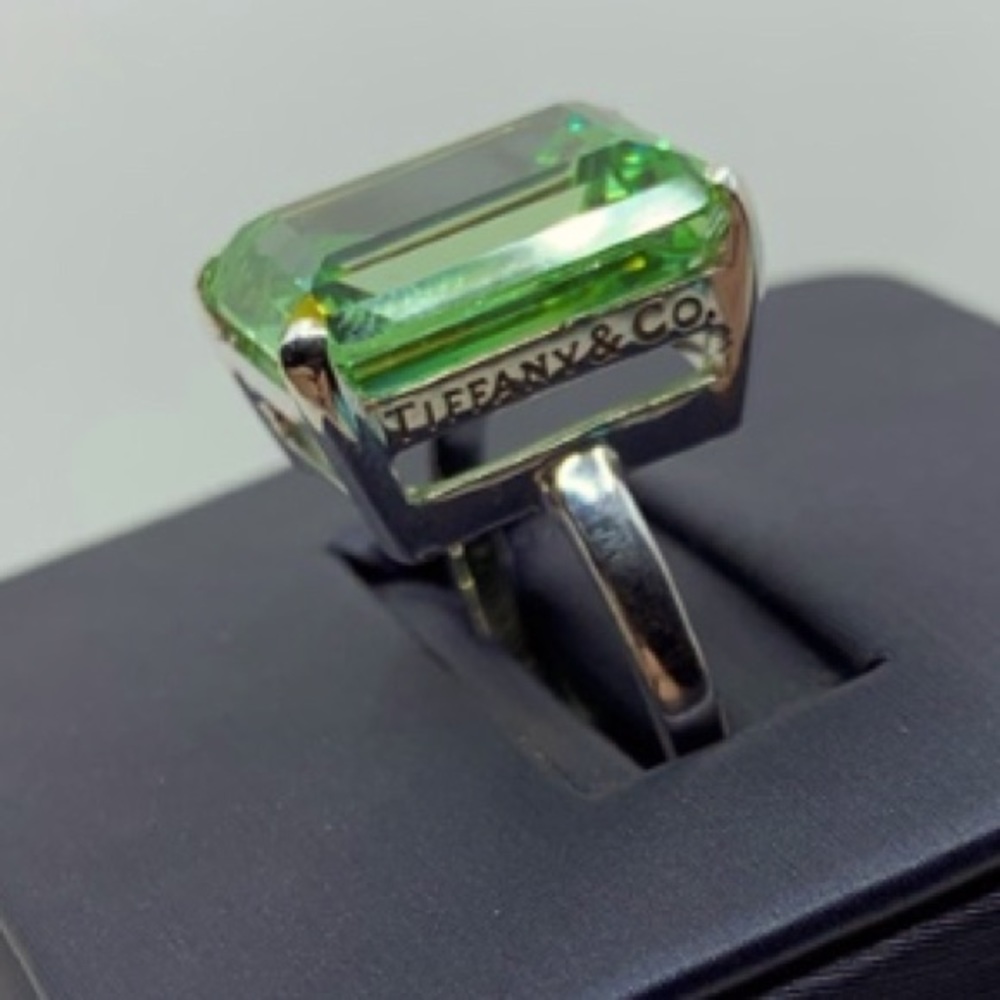 Tiffany & Co green cocktail ring w a silver band.